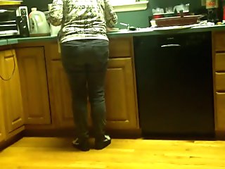 Ass in tight jeans in the kitchen